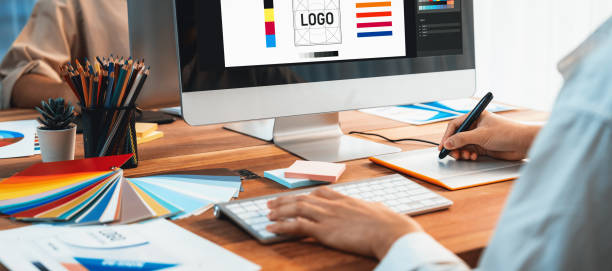 istock Graphic designer works on computer laptop with digital pen. Scrutinize 2149922696