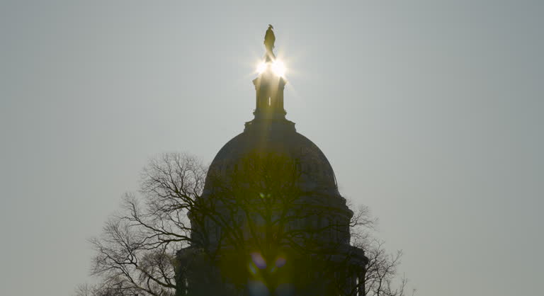Sun Passing Behind Statue Atop U.S. Capitol Dome