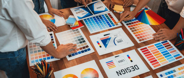 istock Graphic designer brainstorming logo and graphic arts at workshop. Scrutinize 2149922777