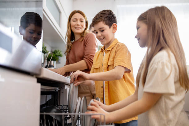 istock Kids help with dishwashing as parents watch 2149923577