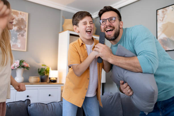 Father and son sharing a karaoke moment