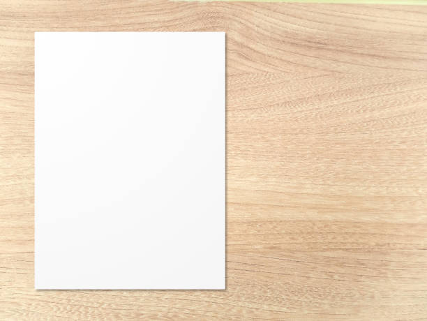 istock white paper on brown wood texture 2149923653