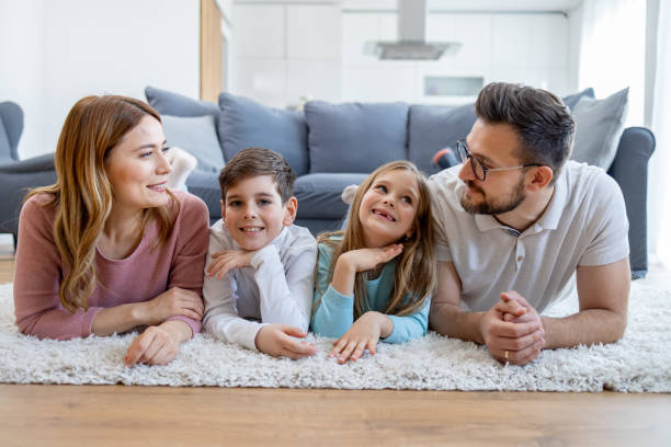 istock Family on floor  smiling 2149924236