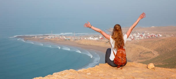 istock Woman tourist looking at panoramic Morocco coast- Imsouane 2149925636