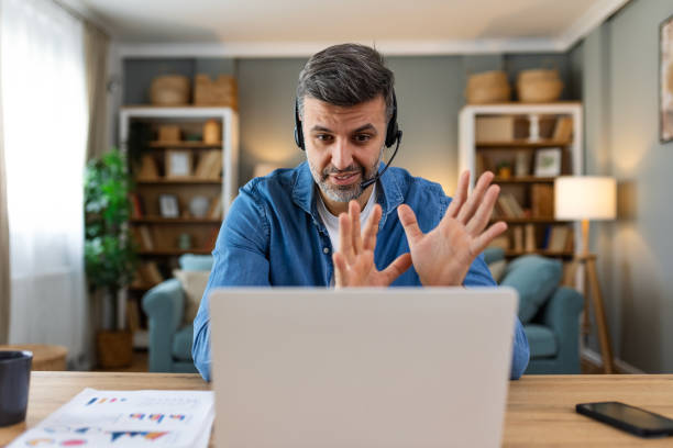 istock Friendly operator man agent with headsets. business man wearing microphone headset working in the office as a telemarketing customer service agent, call center job concept. 2149927018