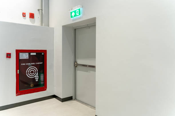 istock Fire extinguishers and fire escape door within shopping mall 2149927188