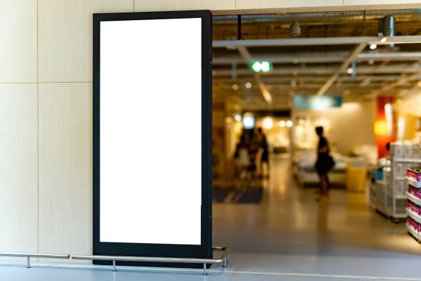 istock Mockup vertical blank billboard with black frame at front of shoes shop 2149927203