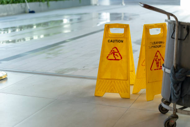 istock Two Yellow caution wet floor sign on Wet floor 2149927236