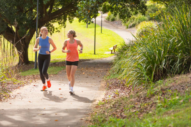 istock Young women running on a concrete path 2149927529