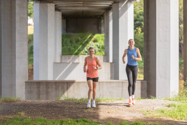 istock Young women running under a concrete bridge 2149927539
