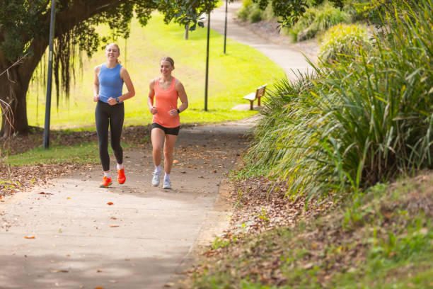 istock Young women running on a concrete path 2149927562