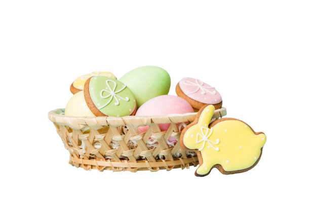 Colorful easter cookies in basket with Multi colors Easter eggs isolated on white background. Pastel color Easter eggs. holiday concept.