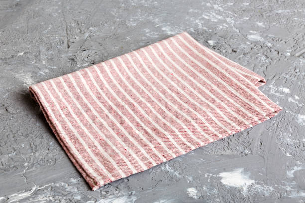istock top view with red empty kitchen napkin isolated on table background. Folded cloth for mockup with copy space, Flat lay. Minimal style 2149927890