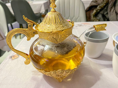 Ornate golden glass Chinese teapot