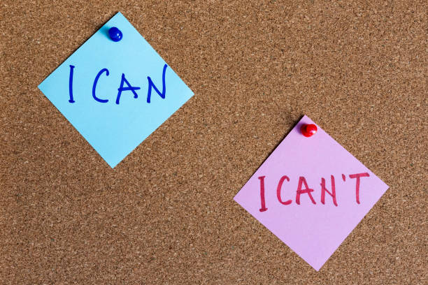 istock I can and I can't phrases written on sticky notes pinned at cork board 2149930973