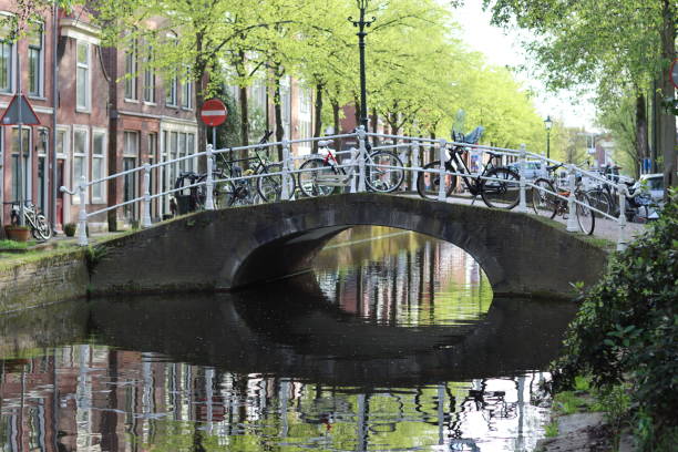 istock Arch bridge over a canal in Delft, Netherlands 2149931512