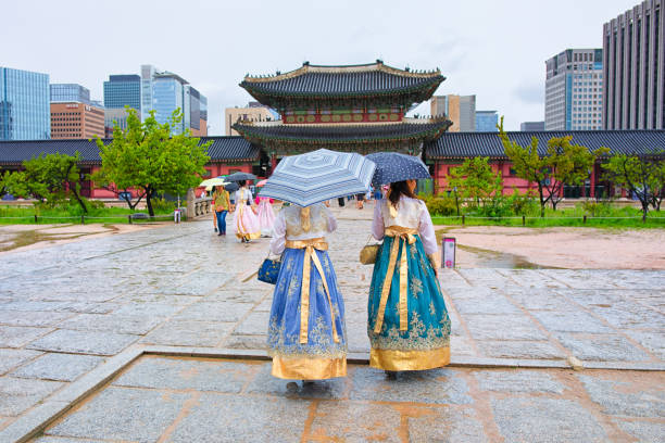 Seoul, Korea - August 15th 2019, Ladies wearing Korean Traditional Hanbok, visit Gyeongbokgung Palace at the rainy day in Downtown Seoul Korea. 서울 경복궁