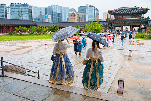 Seoul, Korea - August 15th 2019, Ladies wearing Korean Traditional Hanbok, visit Gyeongbokgung Palace at the rainy day in Downtown Seoul Korea. 서울 경복궁