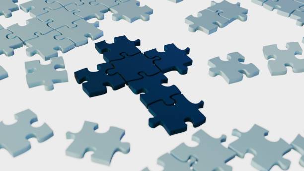 istock jigsaw pieces assembly Christianity cross 2149932128