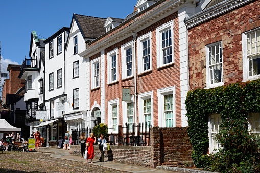 Traditional buildings in Cathedral Close with part of Mols to the rear, Exeter, Devon, UK, Europe.