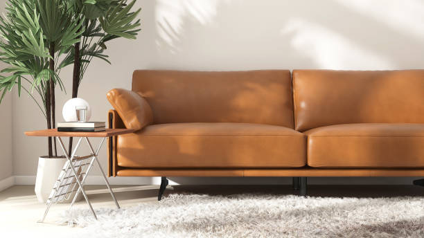 istock Mid century style, luxury brown leather sofa, side table, tree in minimal living room in sunlight on white wall, beige floor 2149934691