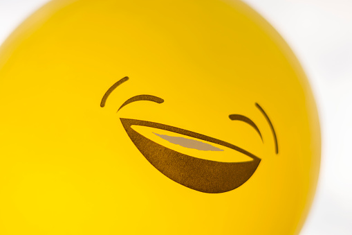 Happy yellow balloon outdoors
