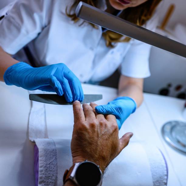 istock Man doing manicure at a beauty salon 2149937948