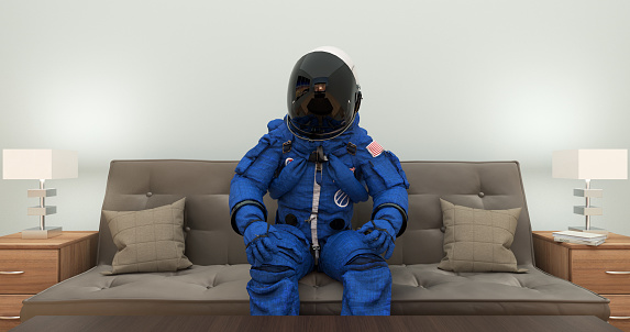 Astronaut In Blue Space Suit Watching TV Movie. Excited And Moving Constantly. Space And Technology Related Scene.