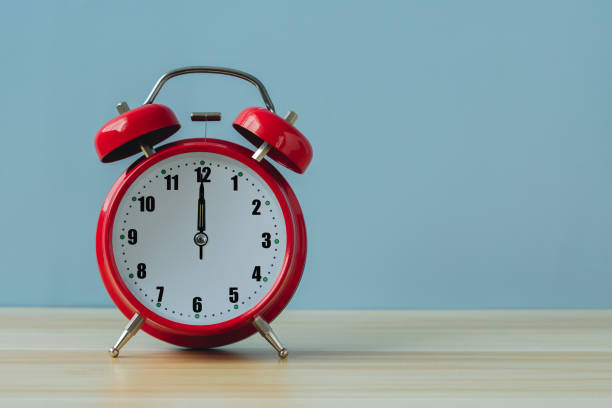 istock Red vintage alarm clock on the table with blue background.Time concept. Copy space. 2149938606