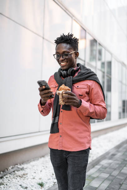 istock Young man using cell phone outdoors 2149938717