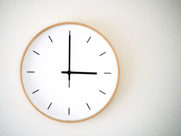 istock minimal wall clock on white show 15.00, 3.00 2149939233