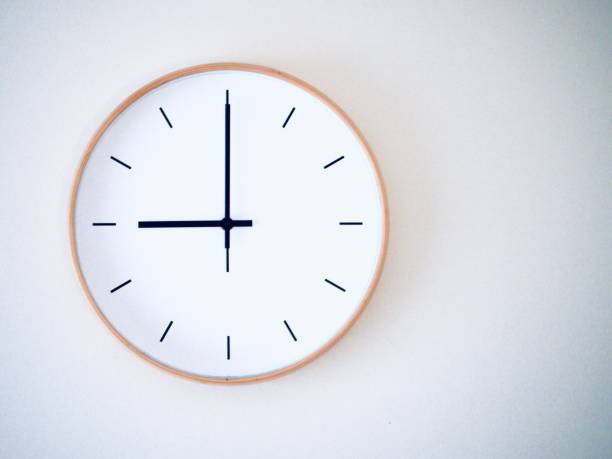 istock minimal wall clock on white show 21.00, 9.00 2149939236