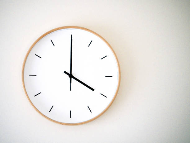 istock minimal wall clock on white show 16.00, 4.00 2149939237