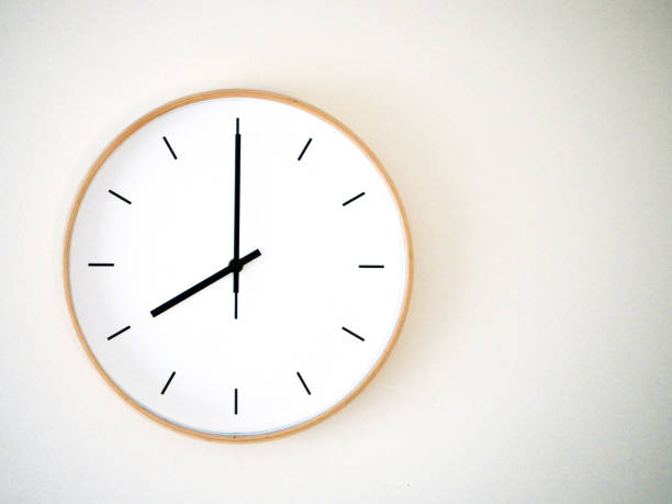 istock minimal wall clock on white show 20.00, 8.00 2149939238