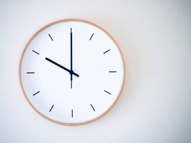 istock minimal wall clock on white show 22.00, 10.00 2149939240