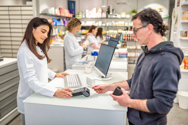 istock Male customer making payment using contactless credit card 2149939288