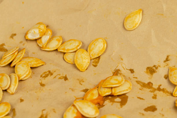 Orange pumpkin seeds close up, seeds from an old orange pumpkin