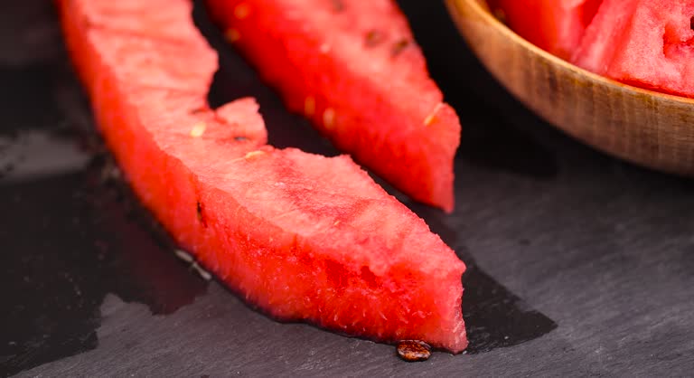 sliced red watermelon into pieces