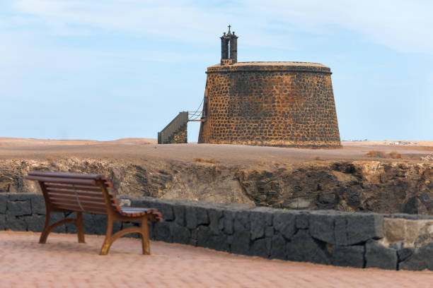 View of the medieval tower at Atlantic Coast in Lanzarote. Castillo de San Marcial de Rubicon de Femes in Playa Blanca, Lanzarote Canary Islands