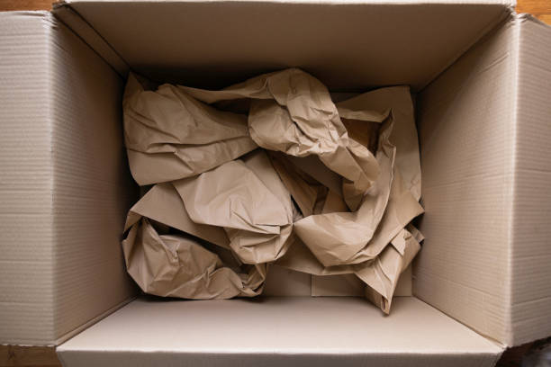 istock Crumpled wrapping recycling paper in big cardboard box 2149941070