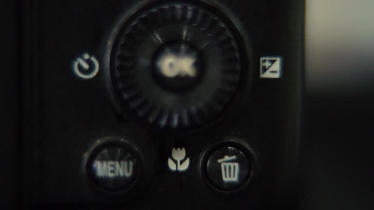 Macro shot of a DSLR camera, menu buttons close up, studio lighting, photography gear, slow motion 120 fps, Full HD video, slide down movement