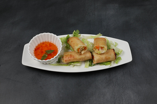 Vegetable spring roll is a tantalising fusion of fresh, crunchy vegetables, aromatic seasoning, and a delicate, crispy wrapper
