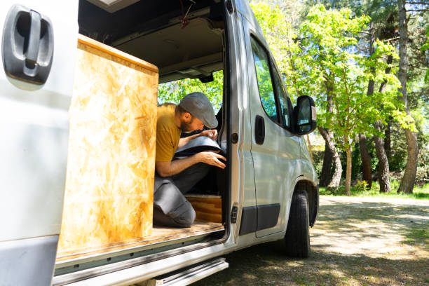 istock Caucasian man putting thermal insulation on a camper van 2149943617