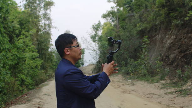 istock A Nepali man is trying to setup mobile phone gimble 2149945150
