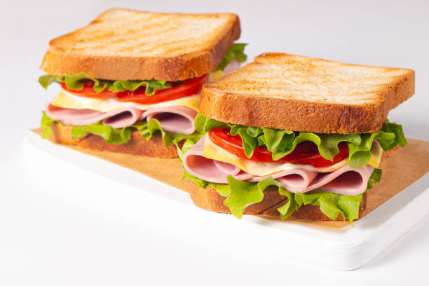 istock Club sandwich with ham, cheese, tomato and lettuce. 2149947141