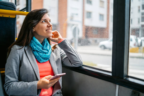istock Young Woman Using Phone While Riding In A Bus 2149951863