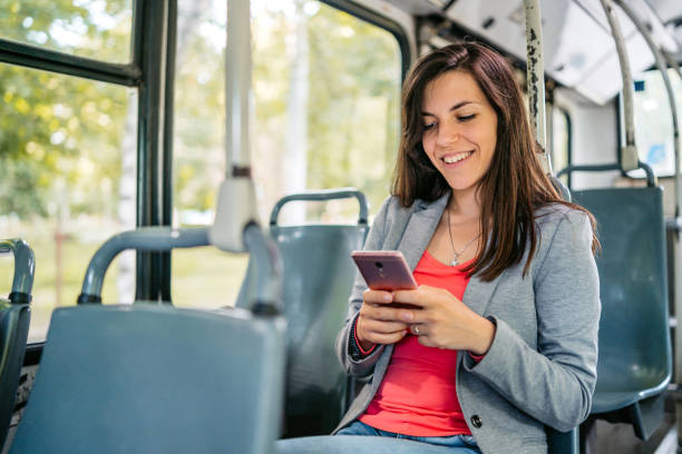 istock Young Woman Using Phone While Riding In A Bus 2149951943