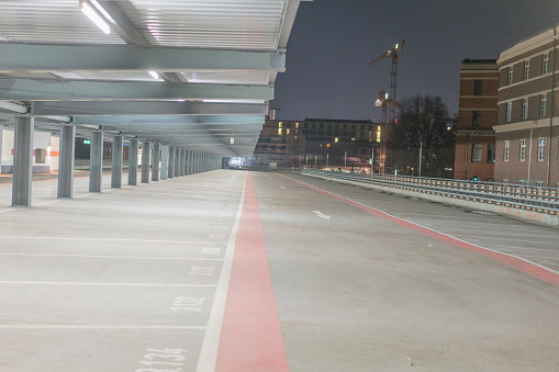 This picture shows a photo of Berlin from 2016, showing modern Berlin at night. These are parking spaces at the Gleisdreick S-Bahn station, Berlin Mitte.