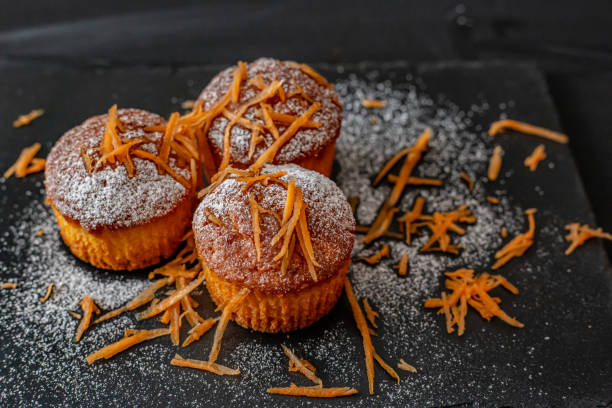 Carrot  muffins on dark background