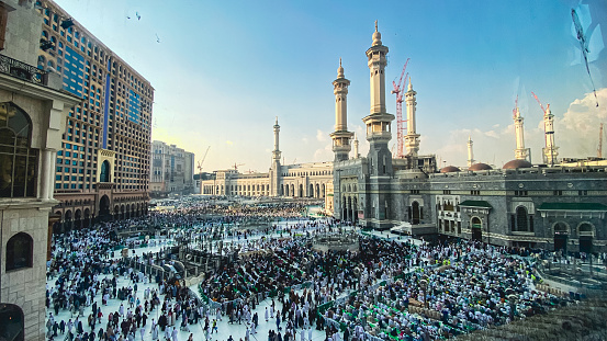 View of pilgrims infront of the Masjidil Haram in Mecca during hajj and umra. Masjidil Haram in Mecca is the holiest and most visited mosque for all Muslims